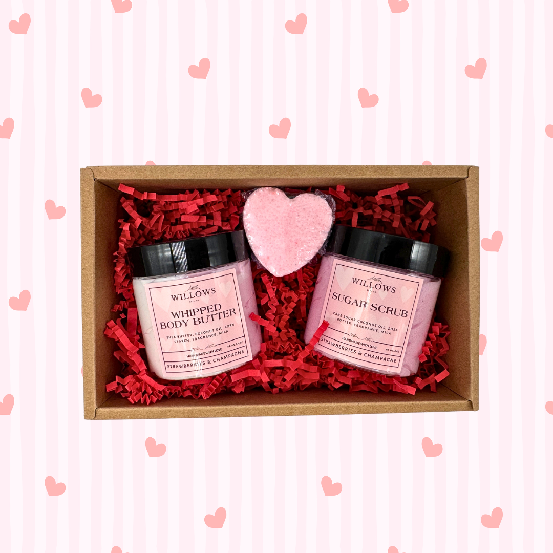 Willows body care set with body butter and sugar scrub in a box on a pink heart-patterned background