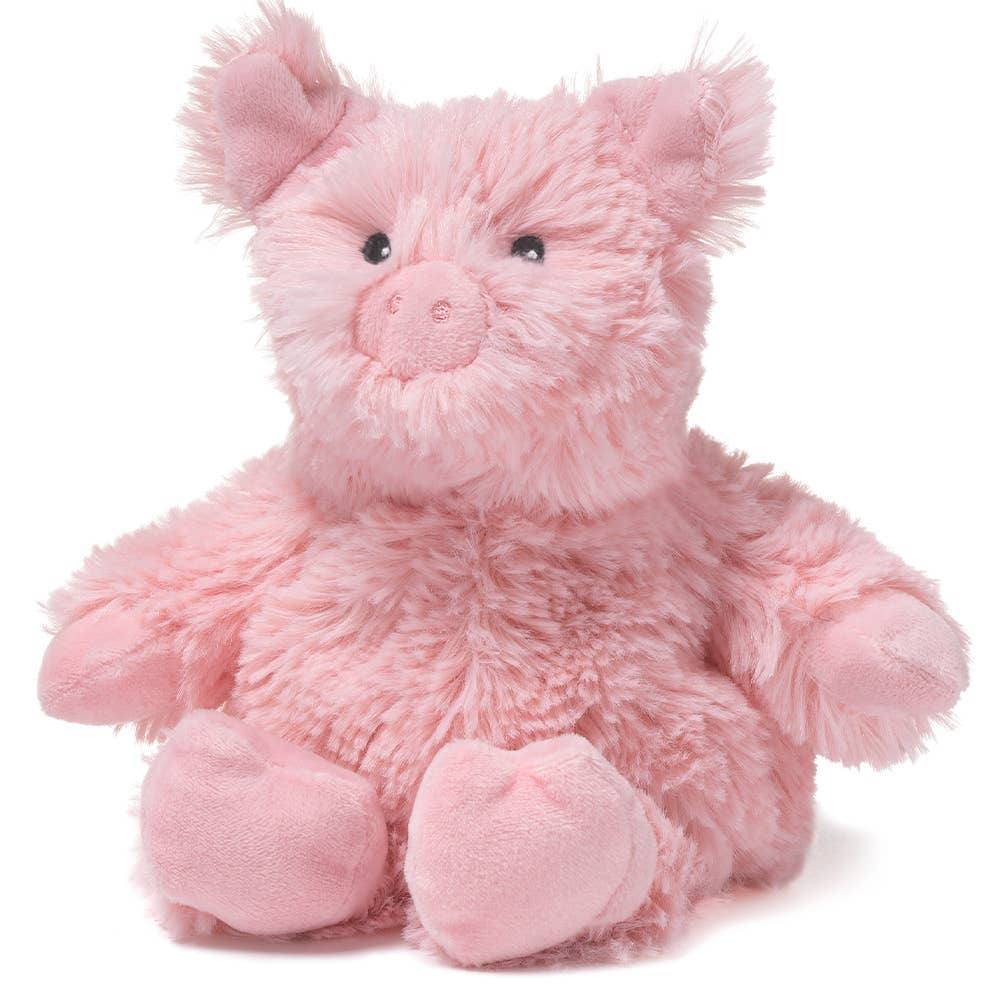 Pink plush pig toy on a white background