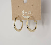 Gold hoop earrings on a 'Betty Oh!' branded card against a white background
