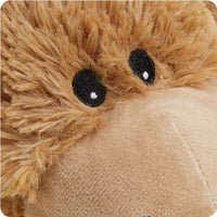 Close-up of a plush donkey toy with brown fur and black eyes.