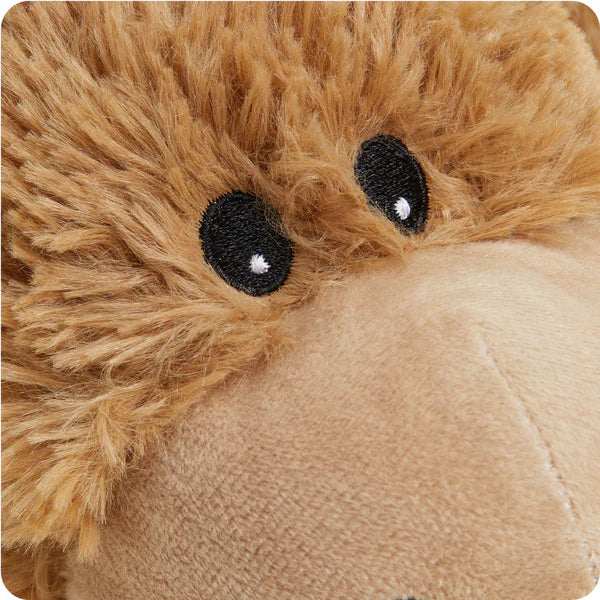 Close-up of a plush donkey toy with brown fur and black eyes.