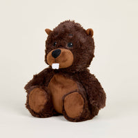 Plush bear toy on a beige background