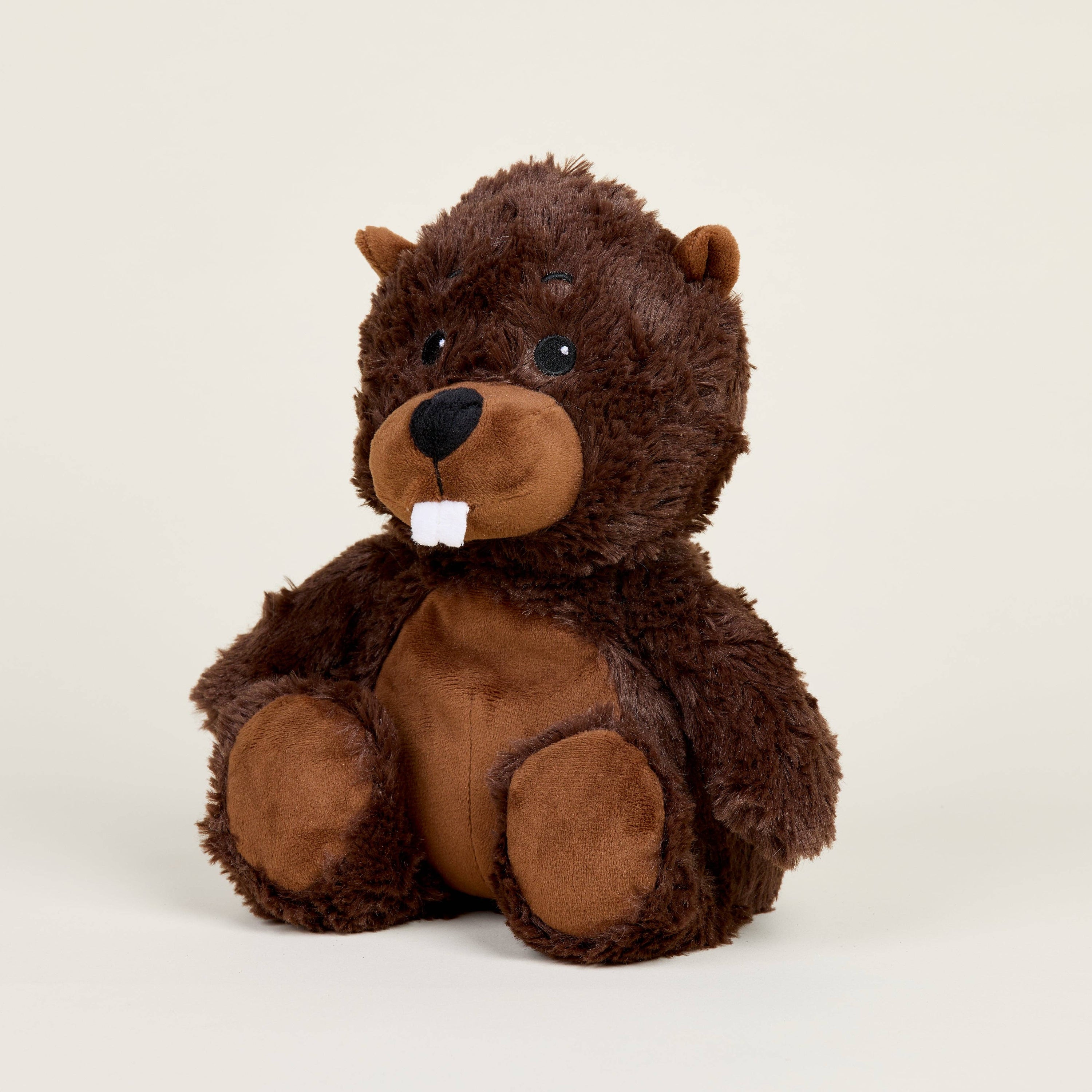 Plush bear toy on a beige background
