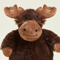 Plush moose toy on a beige background